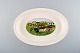 Villeroy & Boch Naif dinner service in porcelain. Oven proof dish decorated with 
naivist village motif.