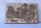 Relief, 5896, i 
keramik af 
Michael 
Andersen. 
Kvinde og mand 
i hestevogn 
gennem byen
Design ...