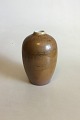 Rorstrand Vase 
with with Light 
brown / Golden 
glaze with 
green shades. 
Nice condition. 
Measures ...