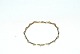Guld Armbånd 
med zikoner 14 
Karat
Stempel: 585, 
Længde 16,5 
cm.
Bredde 3,5 mm 
.
Flot og ...