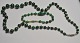 Malekit smykkesæt bestående af kæde og armbånd, 20. årh. Mellem stykkerne forgyldte fugler. ...