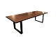 Plank table of 
walnut and 
black metal 
frame, made of 
two planks with 
natural edges. 
The table is 
...