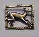 Sterling 
brooch, 20th 
century, 
decoration with 
leaping deer. 
2.8 x 3.2 cm.