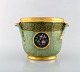 Royal Copenhagen. Early porcelain champagne cooler. Overglaze. Hand painted 
flowers and decoration in gold leaf. Early 20th century.
