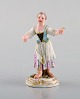 Sjælden antik 
Meissen 
miniature figur 
efter Johann 
Joachim Kändler 
i håndmalet 
porcelæn. Pige 
...