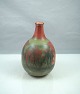 Vase i rødlige 
og grønlige 
farver
Højde 13 cm, 
diameter 9,5 cm
Keramik, ler, 
farver, til ...