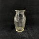 Højde 11,8 cm.
Klar 
presseglas vase 
fra Holmegaard.
Den er vist i 
glasværkets 
katalog fra ...