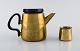 Henning Koppel (1918-81) for Georg Jensen, design 7002.
Coffee pot and creamer in brass. Danish design, 1960