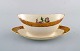 Royal Copenhagen porcelain sauce boat with floral motifs and gold border. Mid 
20th century. Two pieces in stock.
