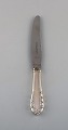 Georg Jensen "Lily of the Valley" dinner knife in sterling silver and stainless 
steel. Dated 1933-44. Three pieces in stock.
