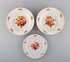 Tre antikke 
Meissen 
tallerkener i 
porcelæn med 
orange 
håndmalede 
blomster. To 
dybe 
tallerkener ...