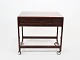 Rullebord med 
skuffe i 
palisander og 
af dansk design 
fra 1960erne. 
Bordet er i 
flot brugt ...