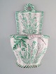 Emile Gallé (1846-1904) for St. Clement, Nancy. Large antique flower pot for 
wall hanging in hand-painted faience decorated with foliage and vegetables. 
1870