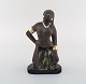 Bengt Wall, 
Sweden. 
Balinese girl 
in raw and 
glazed ceramics 
with gold 
decoration. ...