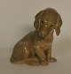 Figur af 
siddende 
gravhund i 
porcelæn fra 
Bing & 
Grøndahl. 
Fremstår i god 
stand uden 
skader ...