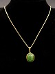 8 karat guld 
halskæde 46 cm. 
og vedhæng 1,9 
x 1,8 cm. med 
jade fra 
guldsmed Poul 
Ibsen ...
