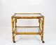 Tray table on wheels of Bamboo and with glass plates from the 1960s.
5000m2 showroom.