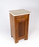 Entrance cabinet of fruit wood with marble top plate from the 1920s.  
5000m2 showroom.
