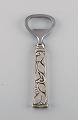 Evald Nielsen Number 30 bottle opener in sterling silver and stainless steel. 
1920s.
