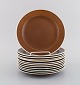 Stig Lindberg for Gustavsberg. Twelve Coq plates. Beautiful glaze in brown 
shades. 1960s.
