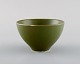 Gerd Bøgelund for Royal Copenhagen. Bowl in glazed ceramics with lotus flower in 
relief. Beautiful glaze in shades of green. Mid-20th century.
