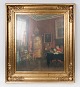Interiør maleri 
på lærred med 
flot forgyldt 
ramme, fra 
omkring 1920.
72 x 64 cm.