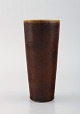 Rörstrand vase 
i glaseret 
keramik. Smuk 
glasur i brune 
nuancer. 
1960'erne.
Måler: 15,7 x 
7 ...