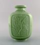 Gunnar Nylund og Harald Salomon for Rörstrand. Art deco vase i glaseret keramik 
med motiver af jagtgudinden Diana. Smuk celadonglasur. 1940