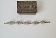 Filigran 
armlænke i sølv
Stemplet 830s
Længde 18 cm. 
Bredde 11 mm.