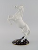 Royal Dux. 
Stejlende hest 
i håndmalet 
porcelæn. 
1940'erne.
Måler: 31 x 19 
cm
I flot ...