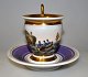 Fransk empire 
kaffekop med 
underkop i 
porcelæn, ca. 
1800. Håndmalet 
motiv med robåd 
med tre ...