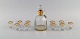 Baccarat, Frankrig. Art deco vodka service til 10 personer. Mundblæst krystalglas med guldkant. ...