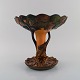 Ipsen's, 
Denmark. Large 
and rare art 
nouveau compote 
in glazed 
ceramics shaped 
like a tree. 
...