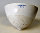 Sj&aelig;lden 
latex gummi 
opsamler kop af 
porcel&aelig;n, 
ca. 1940 fra 
Firestone 
Plantagen, ...