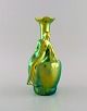Zsolnay art 
nouveau vase in 
glazed ceramics 
modeled with 
sitting woman.  
Beautiful 
luster glaze. 
...