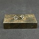 A pair of ear studs by N. E. From