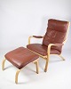 Lænestolen og 
skamlen, model 
MH 101 af 
Mogens Hansen 
fra omkring 
1960'erne, er 
et mesterværk 
af ...