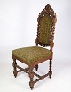 Højryggede stol i massiv egetræ med stil af renæssancen fra omkring år 1910. Mål i cm: H:118 ...