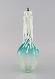 Rare Murano decanter in mouth blown art glass shaped like a candle in a bottle. 
Italian design, 1960s / 70s.
