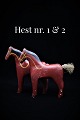 Dekorativ , 
lille udskåret 
træ hest med 
gammel bemaling 
og fin patina. 
H:14cm. L:14cm. 
( Der er ...