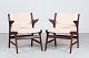 Arne 
Hovmand-Olsen
A pair of 
armchairs made 
of teak with 
brass screws
and 
upholstered 
with ...