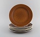 Stig Lindberg for Gustavsberg. Six Coq dinner plates in glazed stoneware. 
Beautiful glaze in brown shades. Swedish design, 1960s.
