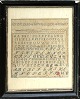 Navneklud fra 
1880. 
Korsstingbroderi 
med talrække og 
alfabetet i 
sort træramme 
med ...