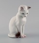 B&G/ Bing & 
Grøndahl - 
Siddende hvid 
kat i porcelæn 
- nr. 2476.
1. sortering. 
Måler: 13 cm x 
...