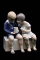 Bing & Grøndahl 
porcelænsfigur 
af lille dreng 
og pige der 
drikker mælk.
H:14cm. ...