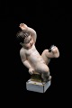 Gammel Bing & Grøndahl porcelæns figur i overglasur af lille dreng med flue. Højde:15cm. Er i ...