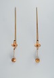 Skultuna, Sweden, four brass candlesticks for wall hanging.Designed by Pierre Forsell.