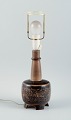 Nils Thorsson, b. Eslöv (1898-1975). 
Royal Copenhagen porcelain table lamp mounted on four feet.