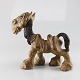 Figur i keramik 
med motiv af 
hest
Design Thomas 
Dam
Mærket DAM
Højde 20 cm
Bredde 20,5 
...