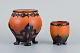 Ipsens Enke. To 
små vaser med 
glasur i 
orangegrønne 
nuancer.
Modelnumre 740 
og ...